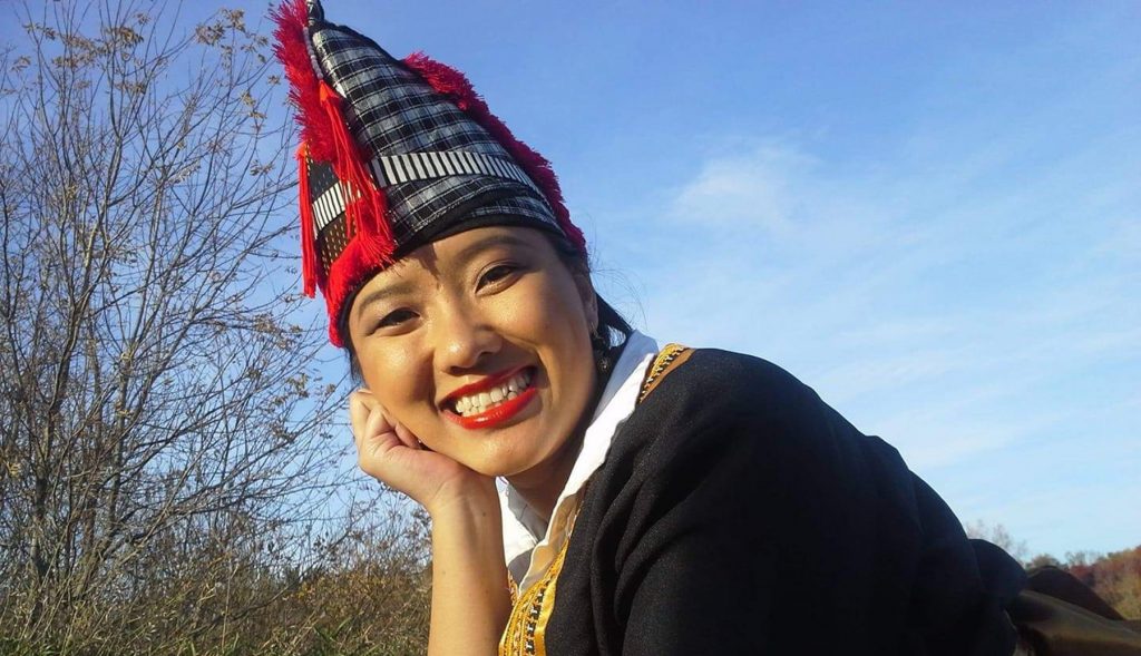 Headshot of woman in hmong clothing