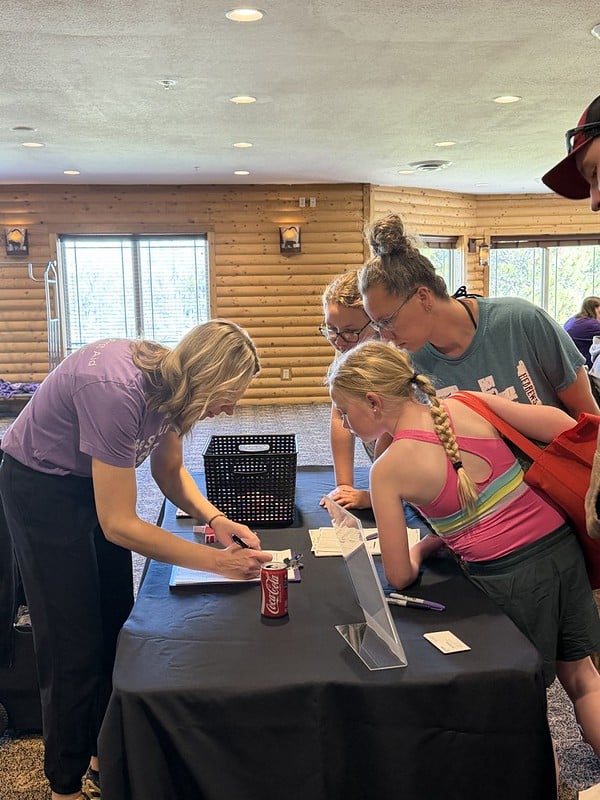 Attendees check into the event with EFMN Outreach Manager Lisa N,