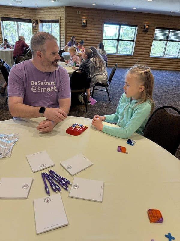 Families playing Tic-Tac-Toe games at the event