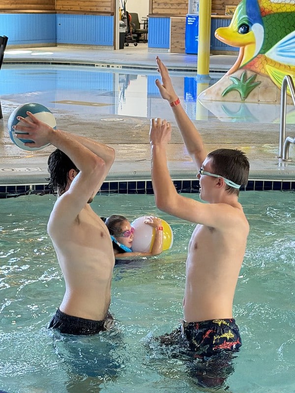 Attendees playing pool ball at the waterpark