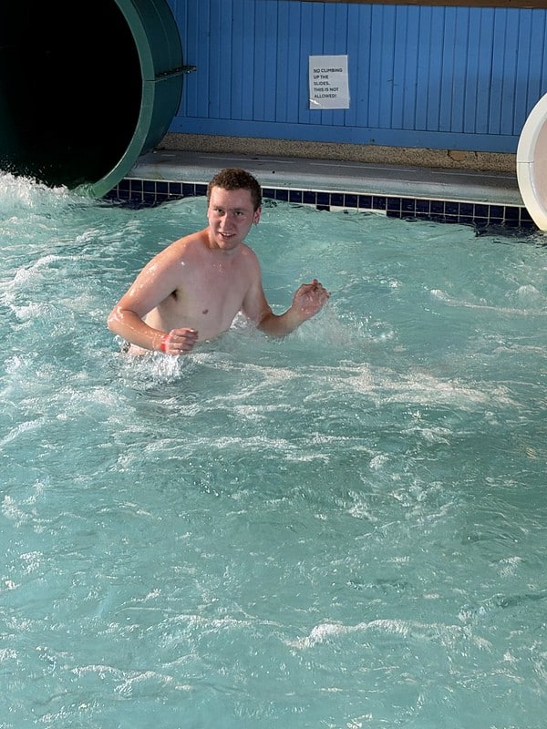 Attendee swimming near the waterslide